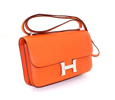 orange hermes crossbody with blue strap|Hermes constance to go bags.